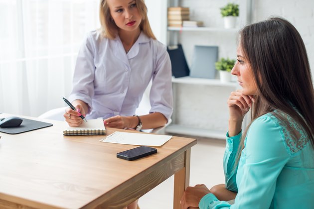 doctor explaining diagnosis to her female patient healthcare and medical