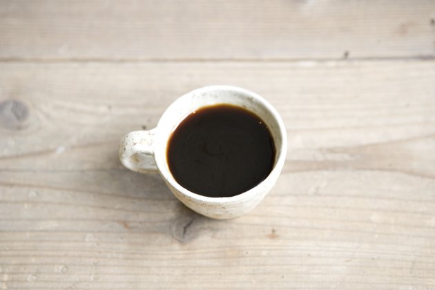 A Cup of Coffee on a Wooden Surface