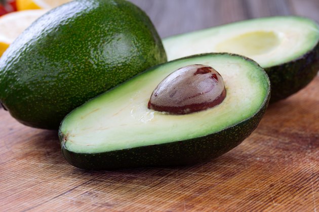 avocado on a dark wood background
