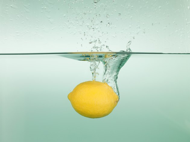 Lemon splashing in water