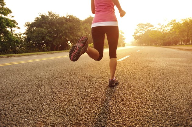 healthy lifestyle fitness sports woman running at driveway