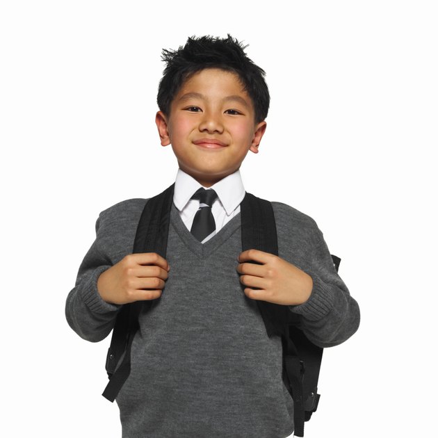 portrait of a schoolboy (8-9) wearing his school uniform