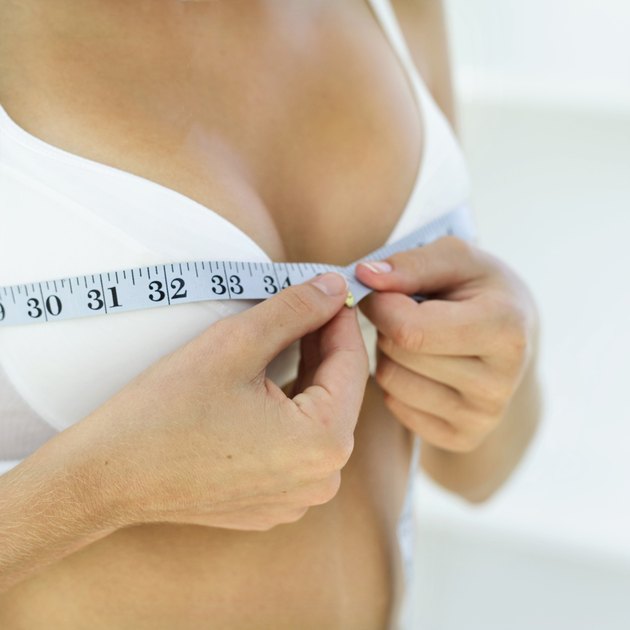 close-up of a woman measuring her bust