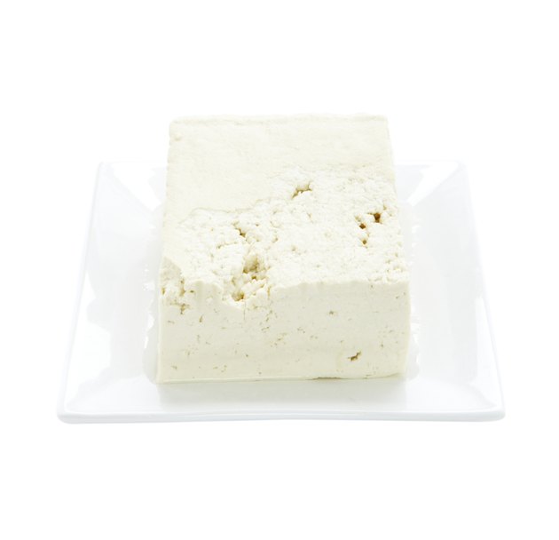 Tofu on plate on white background