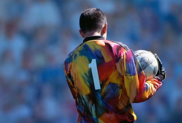 Soccer goalkeeper holding ball