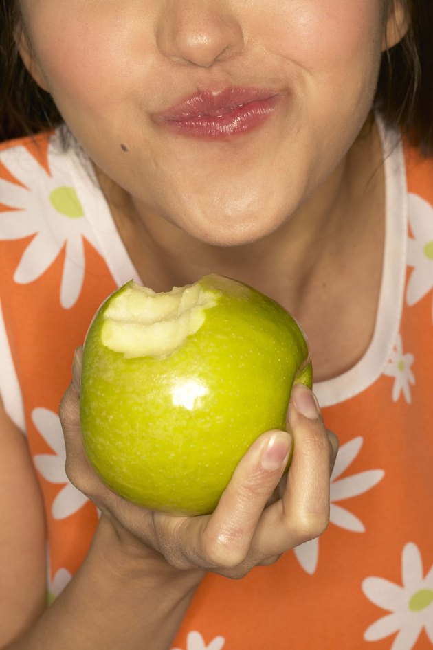 woman eating apple