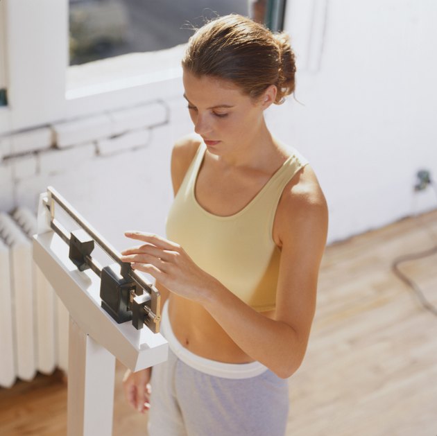Woman Weighing Herself