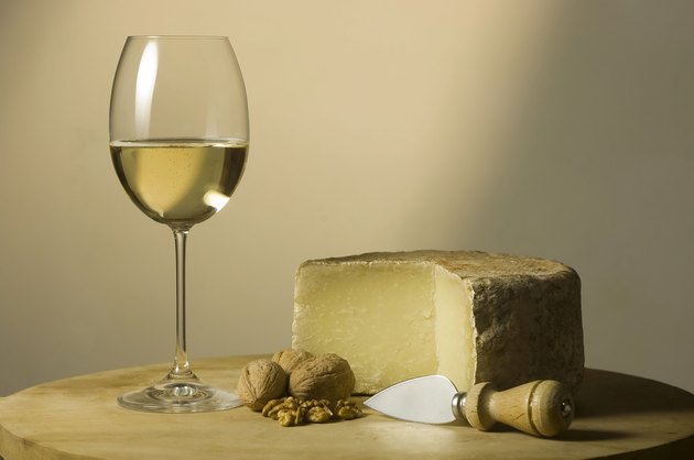 White wine glass and cheese