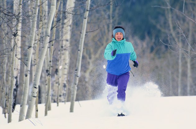 Woman Running in Snowshoes