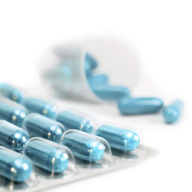 Turquoise capsules isolated on white