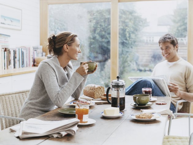 Couple Sits at a Table Over Breakfast