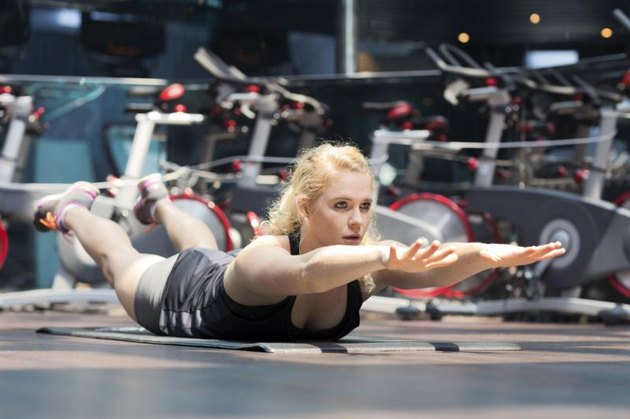 Young girl stretching in the gym