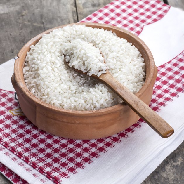 rice on wooden spoon
