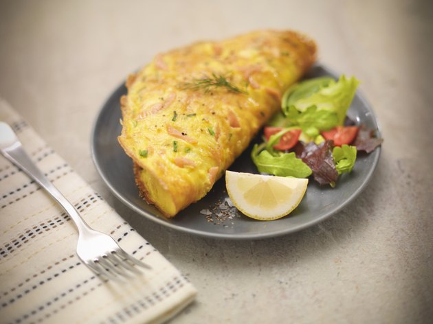 Omelet with Scottish smoked salmon, salad and lemon slice