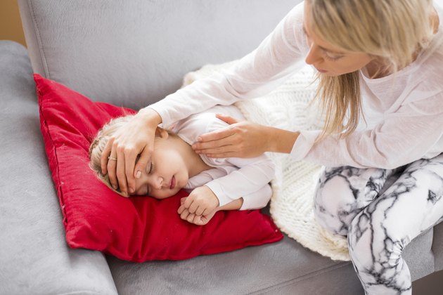 Mother with her sick child at home