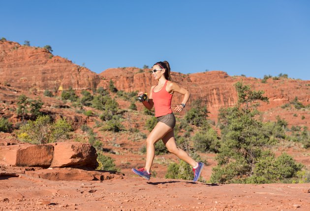 Woman Running Outdoors Uphill