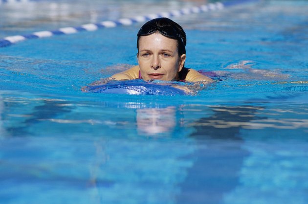 Young woman swimming in pool
