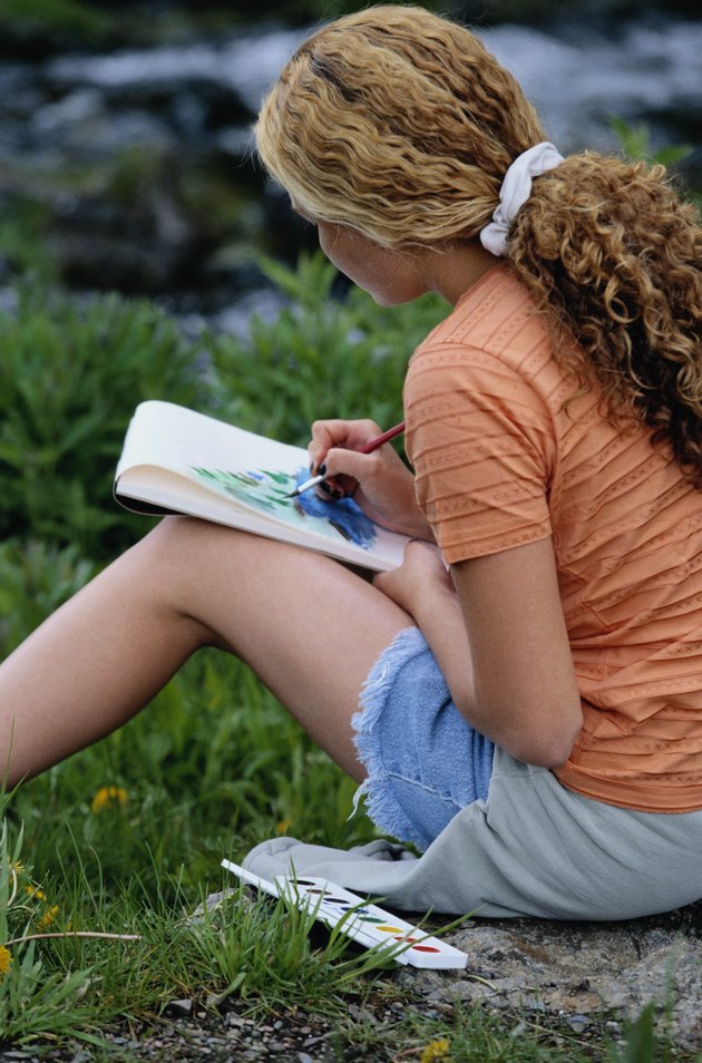 Teen Girl Painting in Notepad