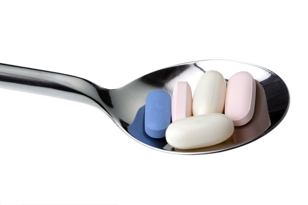 Daily HIV medication on spoon