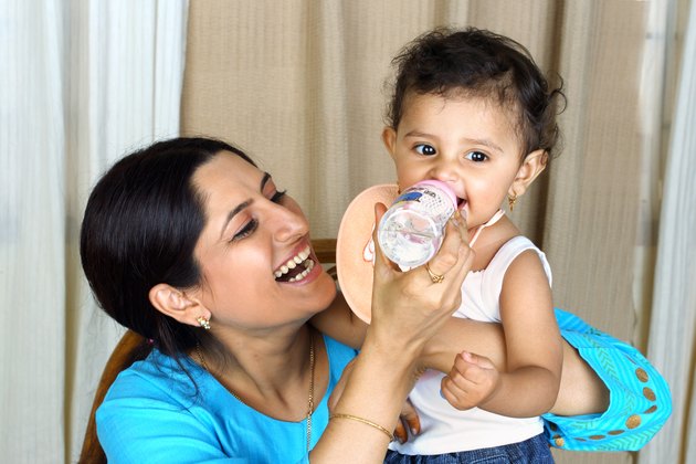 Close up of a mother feeding her child