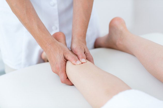 Physiotherapist doing leg massage