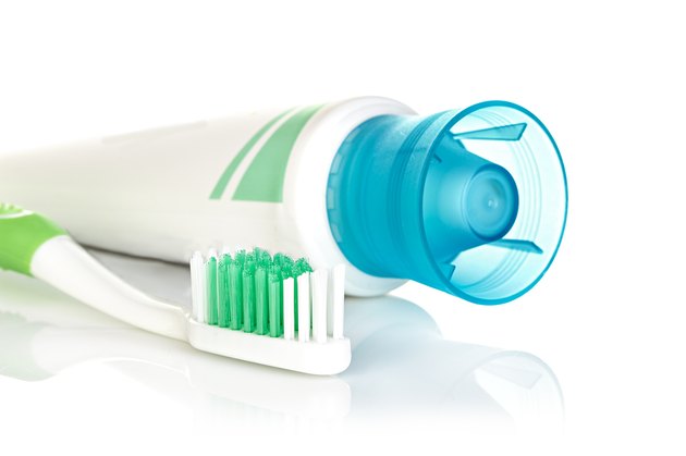 toothbrush with toothpaste isolated on white background