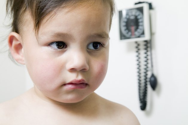 Baby boy sitting in a doctor's office