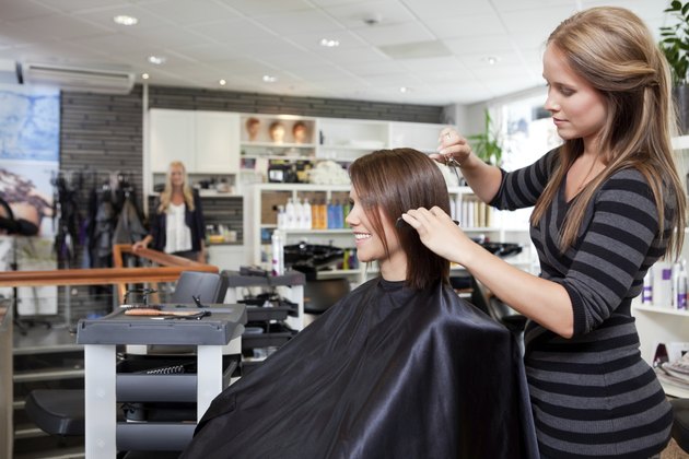 Hairdresser Cutting Client's Hair