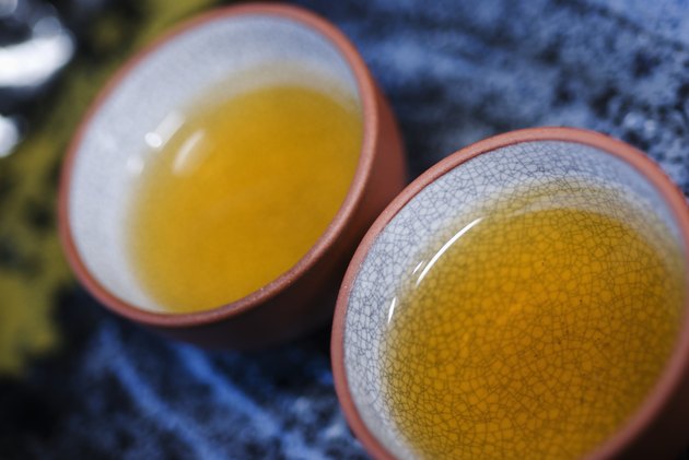 Hot tea served in Asian style teacups.