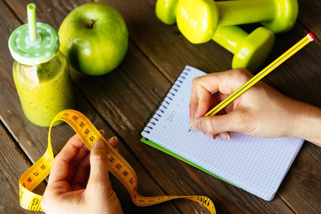 Fitness diet and nutrition routine concept with green detox smoo
