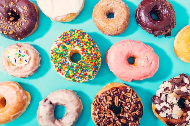 Assorted donuts on a pastel blue background