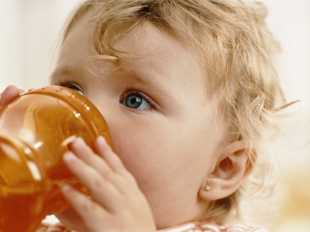 Infant Girl Drinking From a Cup