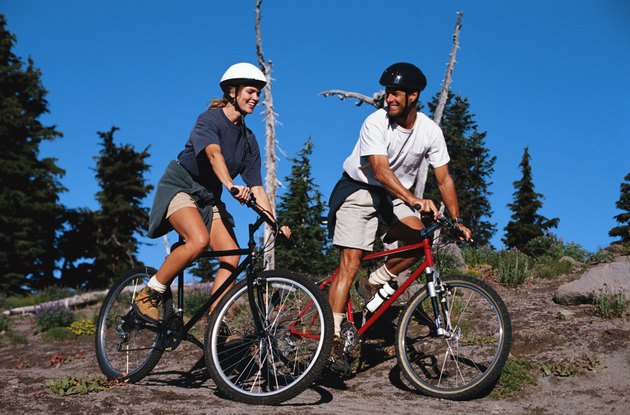 Couple Riding Mountain Bikes