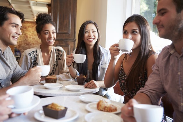 Group Of Female Friends Meeting In Café Restaurant