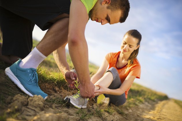 Female runner with twisted ankle