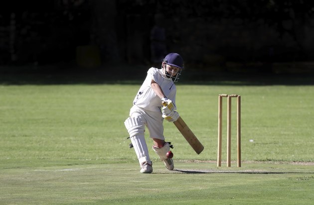 Young boy playing cricket shot