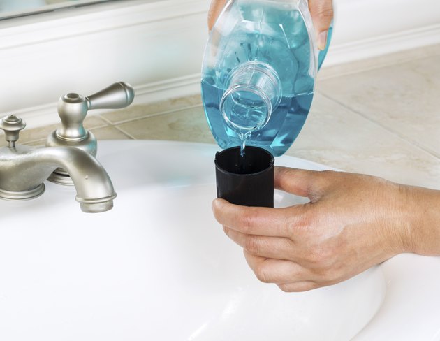 Pouring Mouth Washing into Cap
