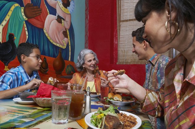 Three generation family taking food in a restaurant