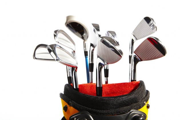 Golf clubs against white background