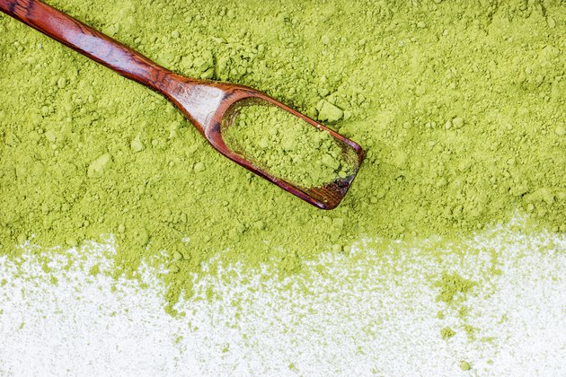 border of powdered green tea top view close up