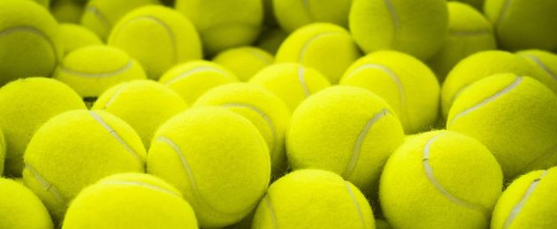 Lots of vibrant tennis balls