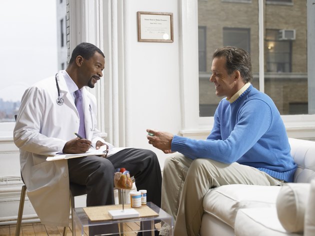 Doctor Discussing Medicine in His Clinic With a Patient