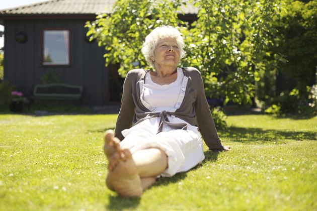 Senior woman enjoying the fresh air in garden