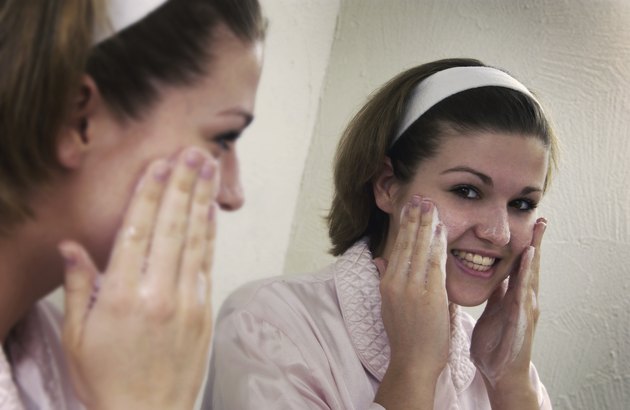 Teen washing her face w/ soap