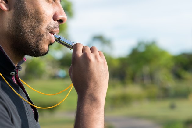 Blowing whistle