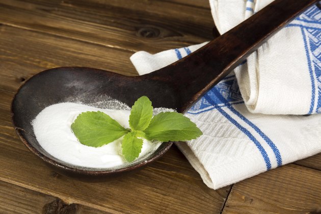 Old spoon with fresh stevia leaf