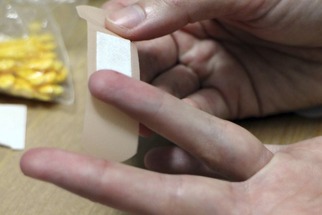 Band-Aid on a tip of a finger