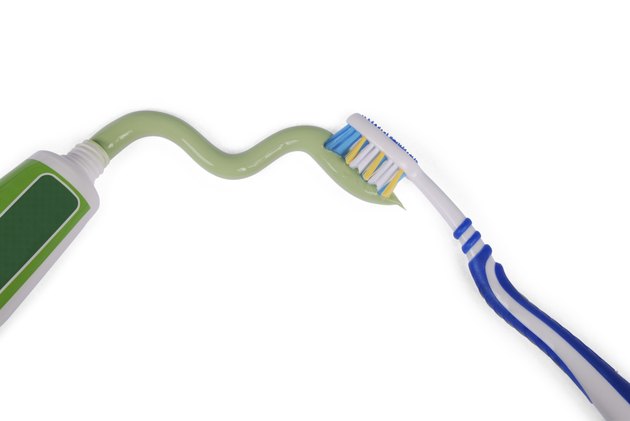 Green toothpaste and toothbrush (clipping path)