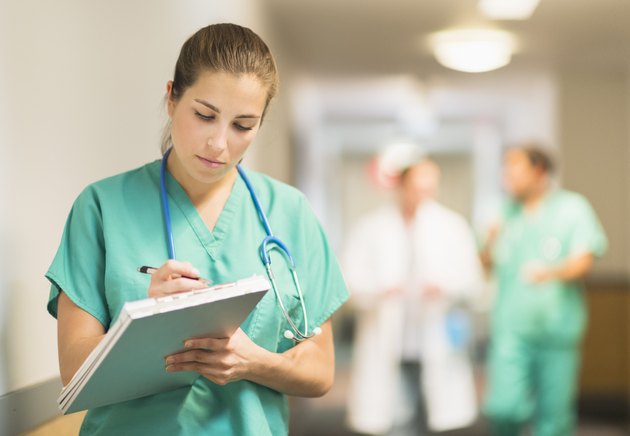 USA, New Jersey, Jersey City, Female doctor in hospital hallway