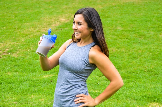 Woman drinking a meal replacement shake (protein shake)